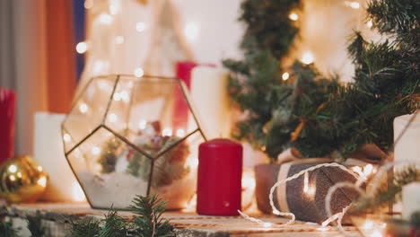 Creative-hobby.-Gift-wrapping.-Packaging-modern-christmas-present-boxes-in-stylish-gray-paper-with-satin-red-ribbon.-Top-view-of-hands-on-white-wood-table-with-fir-tree-branches,-decoration