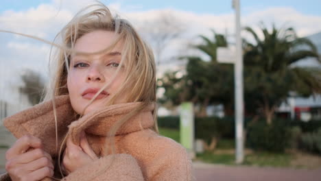 young woman posing for camera in the city.