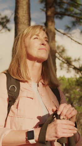 active senior woman hiking in forest