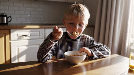 a child eating cereal for breakfast