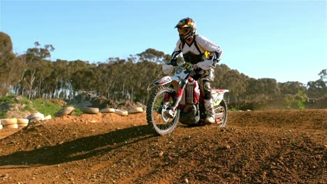 man riding a motor cross bike