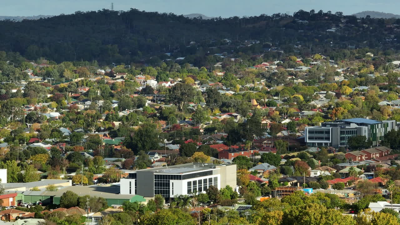Aerial: Drone shot of commercial buildings and houses in Wagga Wagga, NSW Australia