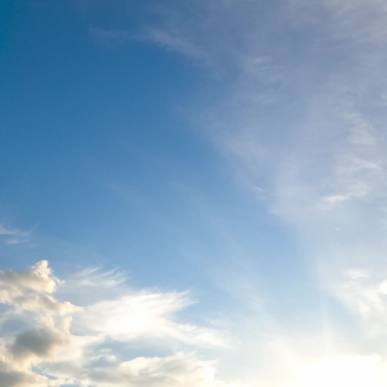 Light weightless spindrift clouds flying in the skies. Summer season azure skies from low angle view. Timelapse