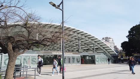 argentine people walk at constitución buenos aires underground station entrance facade panoramic establishing shot at plaza
