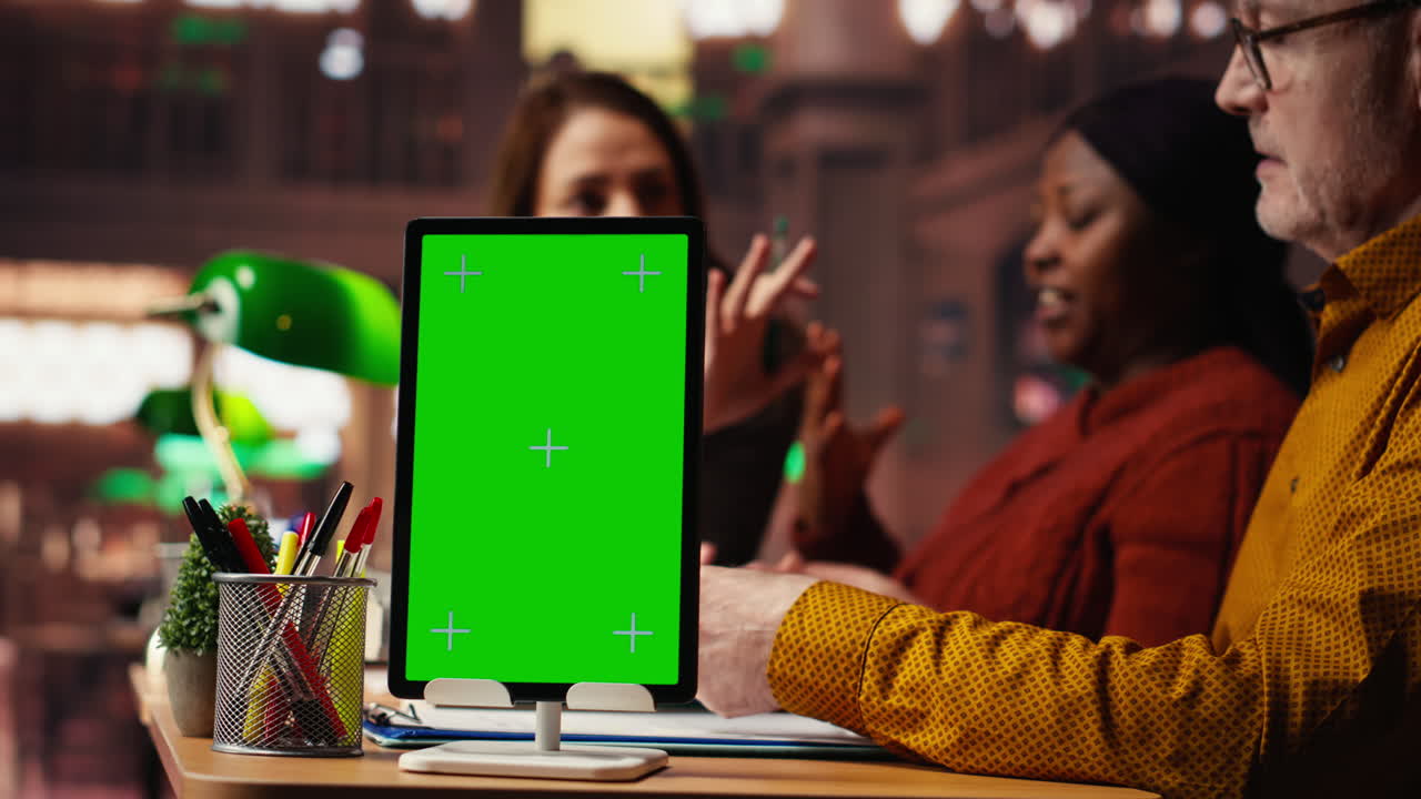 Meeting with green screen tablet