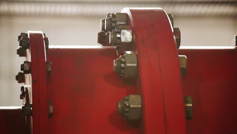 close-up view of a red industrial pipe fitting