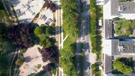 public park centralny in gdynia city center and traffic on freeway, poland - aerial top down flyover