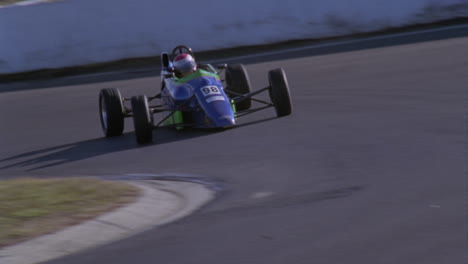 a formula car drives on a circuit track 10