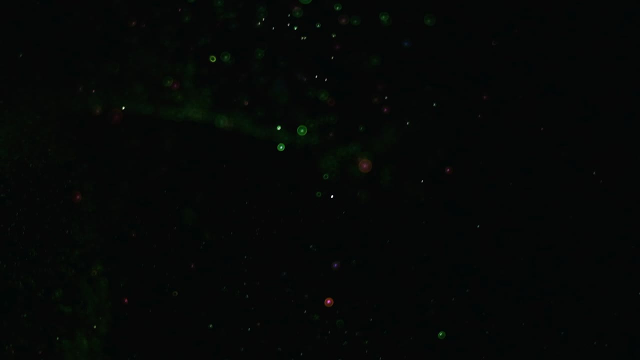 la caída mágica de las partículas brillantes en cámara lenta