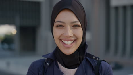 portrait happy young muslim business woman laughing enjoying professional urban lifestyle in city independent female wearing hijab headscarf slow motion