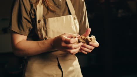 woman shaping clay