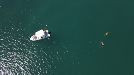 boat swimming people