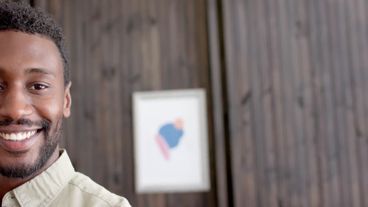 Portrait of happy african american businessman in office in slow motion