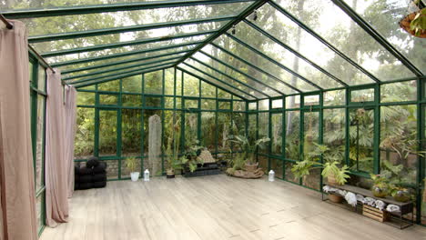 empty glass house with plants and wooden floor, perfect for yoga sessions, copy space