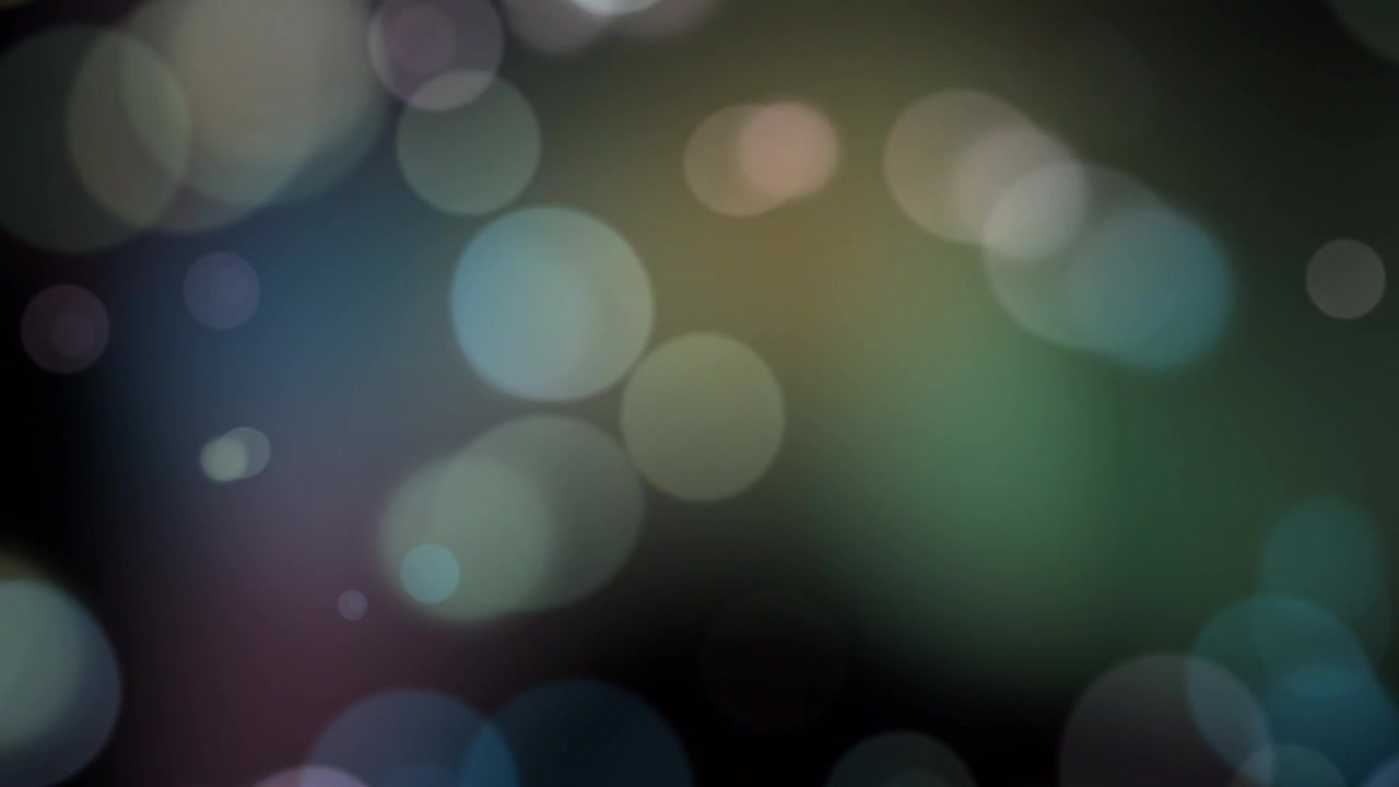 Abstract Colorful Bokeh Light Particles Moving on Black Background