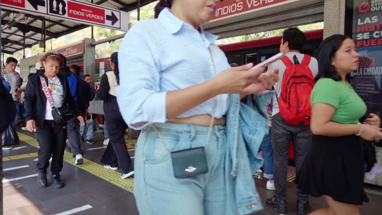 Stabilized shot of people walking in the subway or bus station in Mexico City. Stabilized shot.