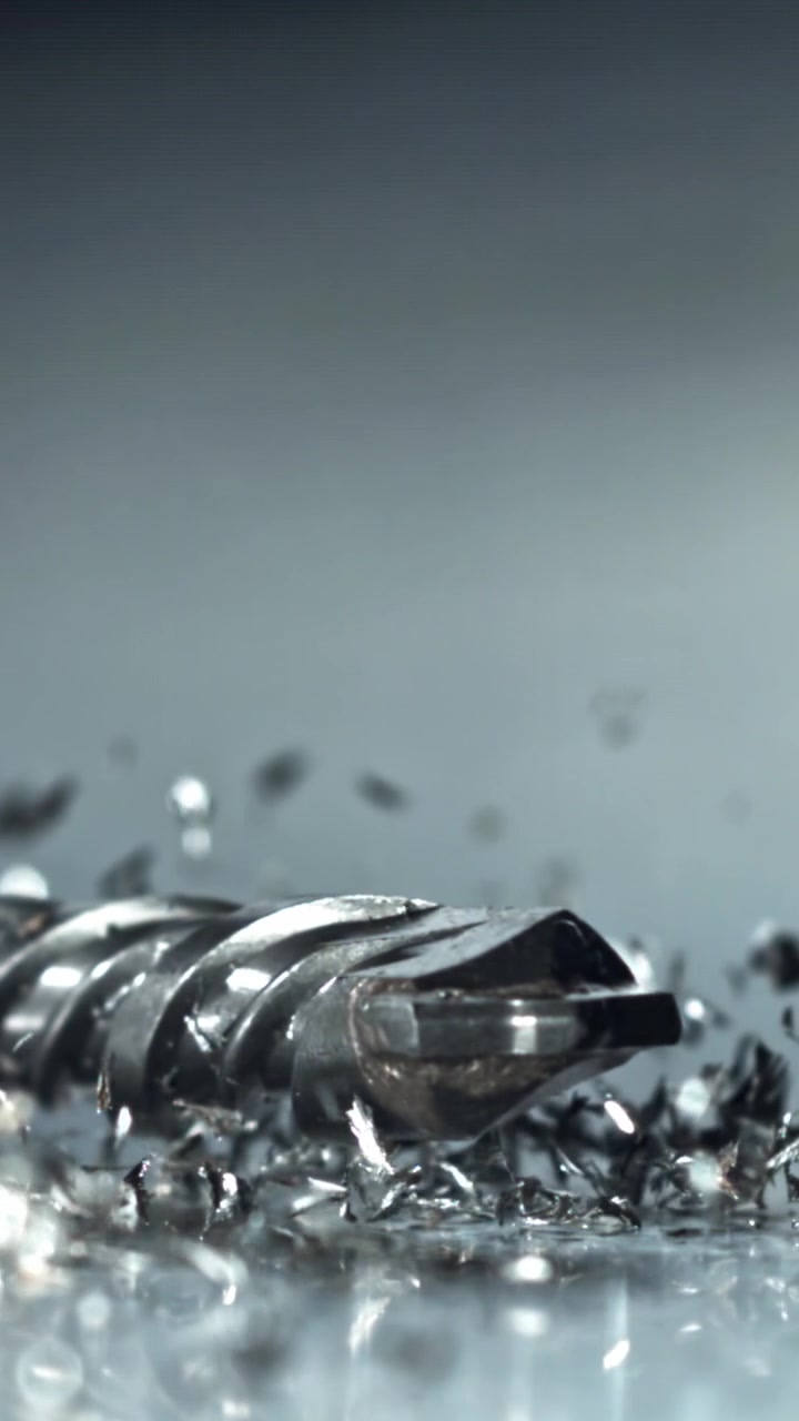 Drill Bit Falling in Slow Motion onto Metal Shavings