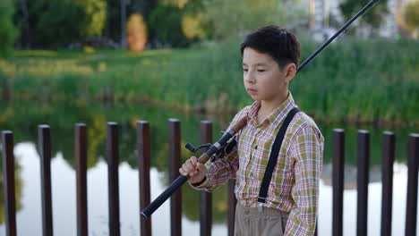 boy fishing in a park