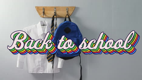 video de animación digital del texto de regreso a la escuela contra el uniforme escolar