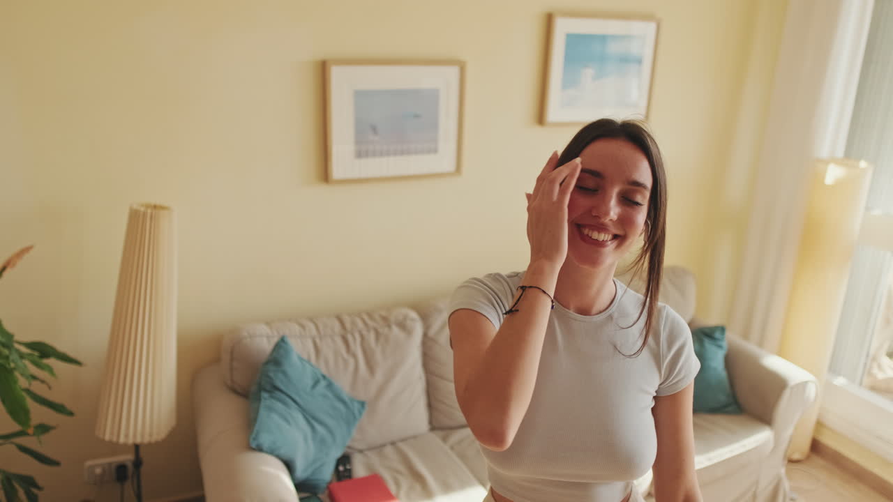 A woman listening to music at home