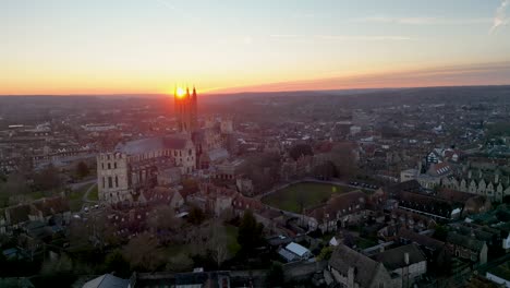 canterbury cathedral with an epic sun set captured by slow moving drone