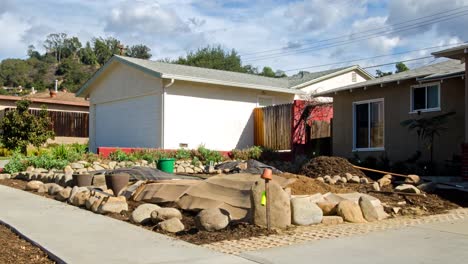 Timelapse-of-a-man-building-a-rock-wall-in-front-of-a-house-in-Oak-View-California-1