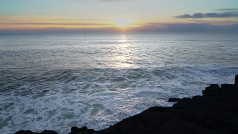 golden sunset over the wavy sea - wide shot