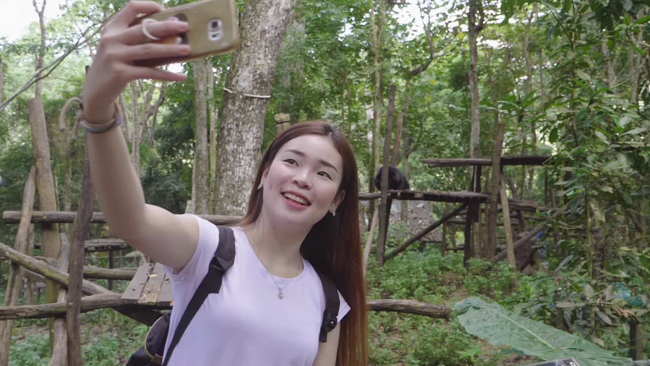 Woman taking a selfie in a zoo