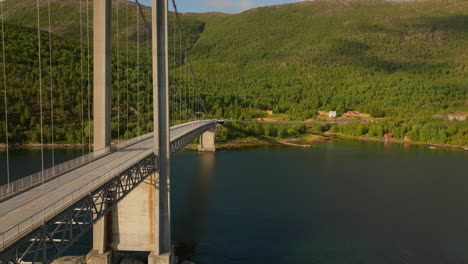 drone close up of kjerringstraumen bru bridge, connection across norwegian fjord