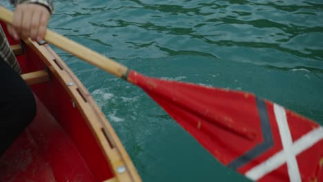 person canoeing on a lake