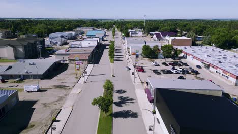 a drone shot of a small abandoned empty mining agricultural town municipality and it's main street killarney manitoba canada