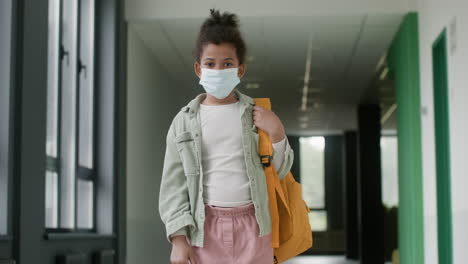 Schoolgirl-with-face-mask-in-school-corridor.