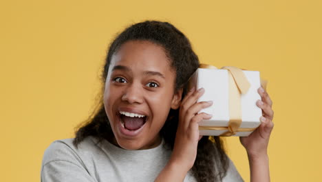 excited teenager with a gift
