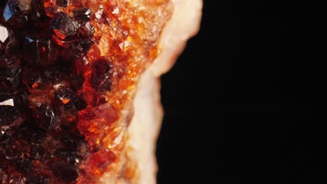 radiant macro shot of a citrine golden quartz crystal sparkling against a dark background, captured through smooth panning and macro lens for intricate surface details