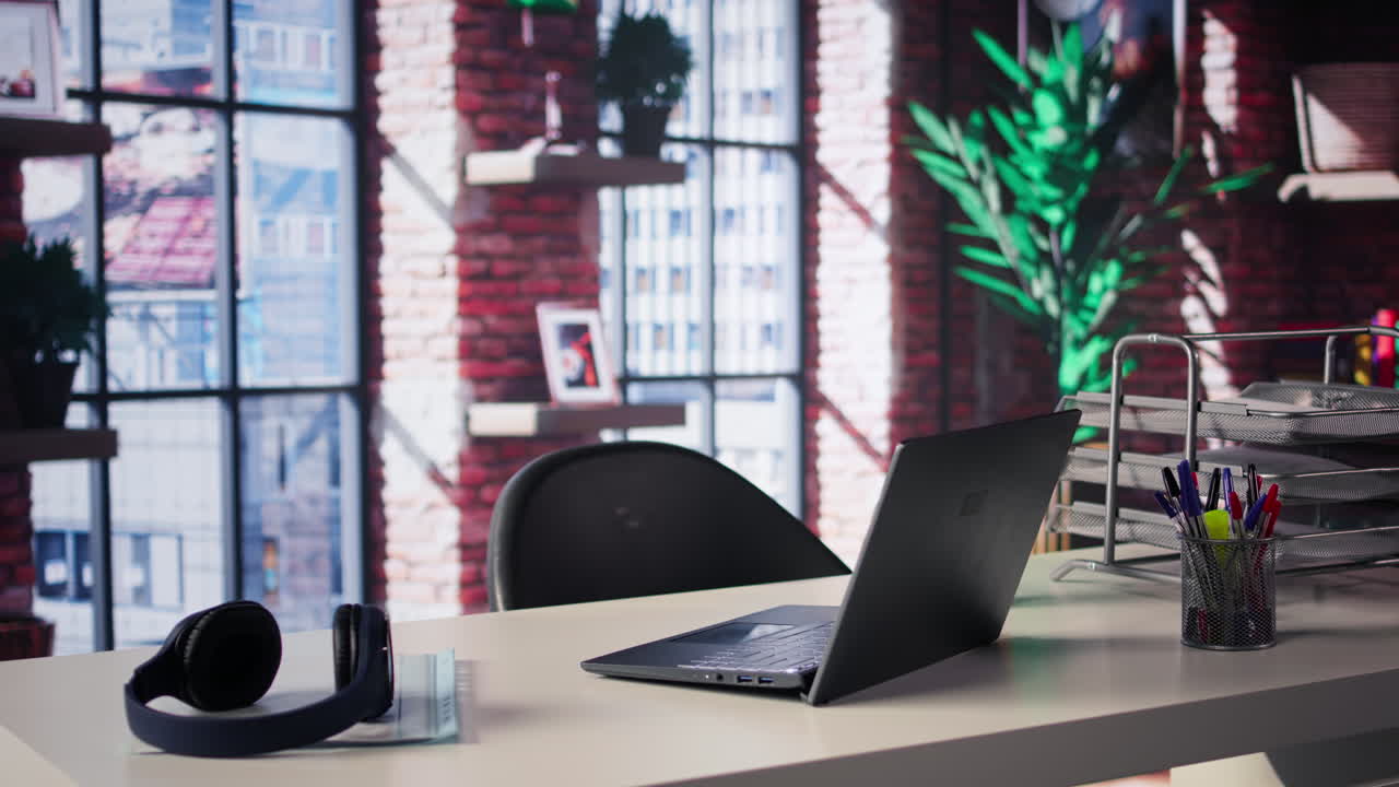 Modern Workspace with Laptop and Headphones