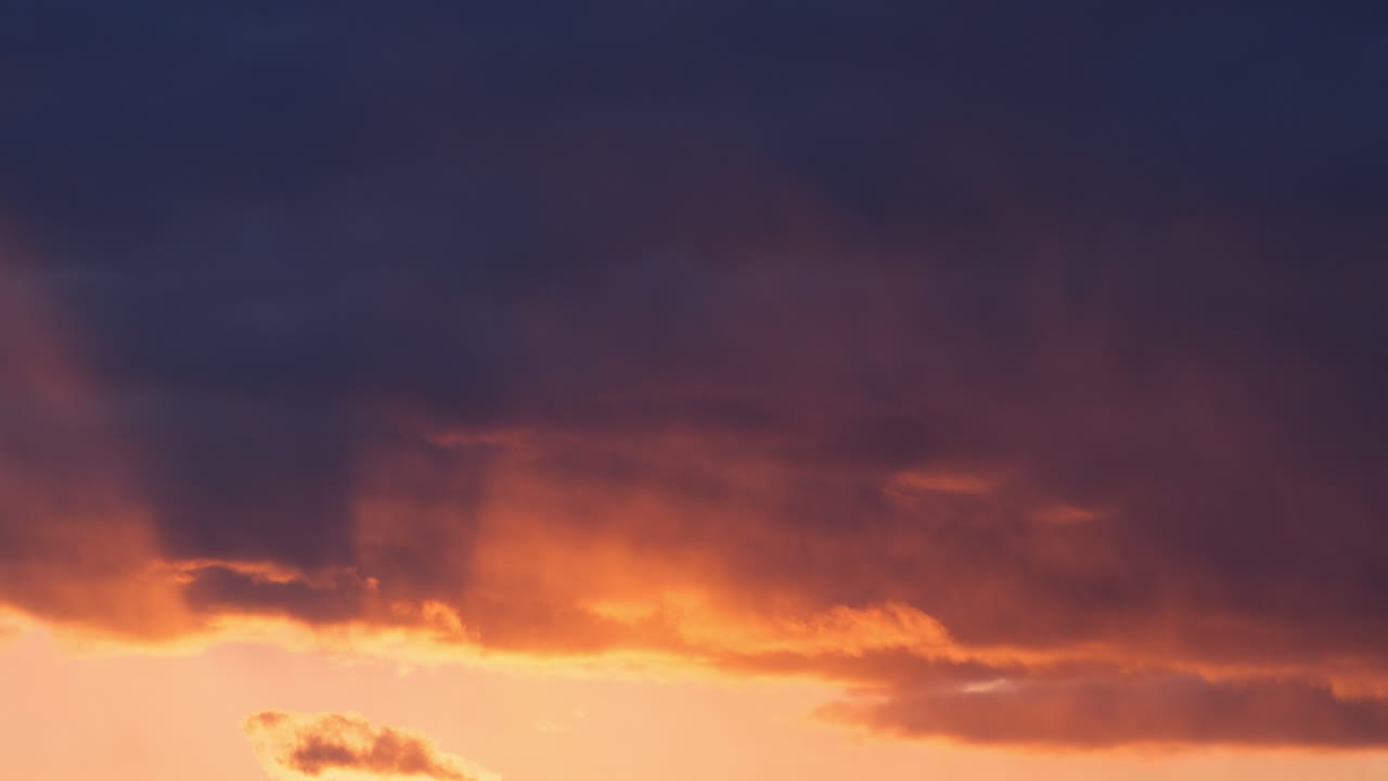Fiery red and deep blue sunset colors paint the sky in a vivid twilight landscape, heavenly beautiful backdrop background