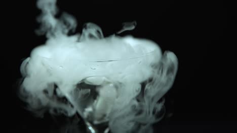 drink in glass of martinis with the effect of dry ice