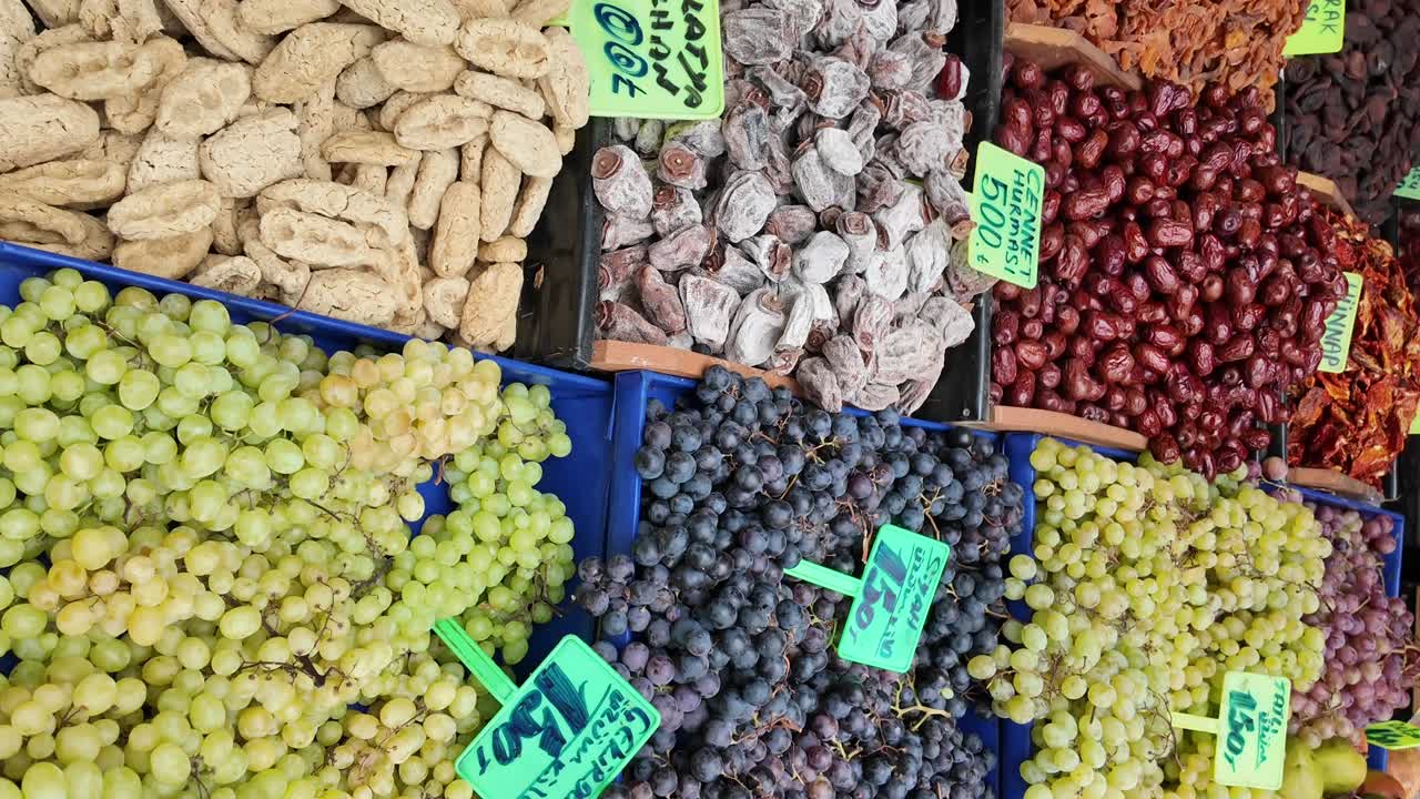Fruit stand with grapes and dried fruit