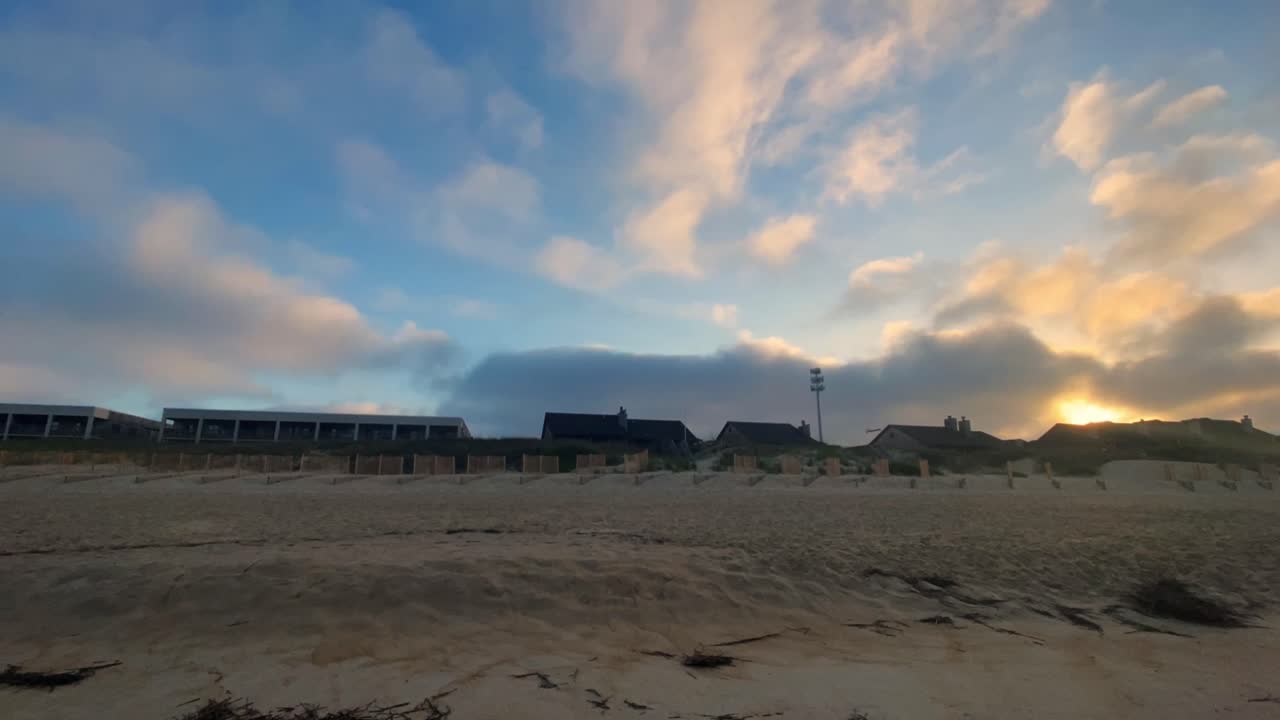 A sunset beach hyper lapse in Nag's head in the outer banks in North Carolina during early summer.