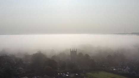 Drone-Shot-Orbiting-Islip-Church-In-Mist-06