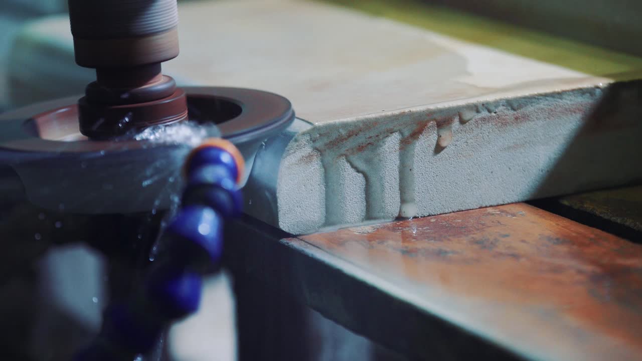 Grinding stone on the machine using water. Automatic sandstone decorative processing machine