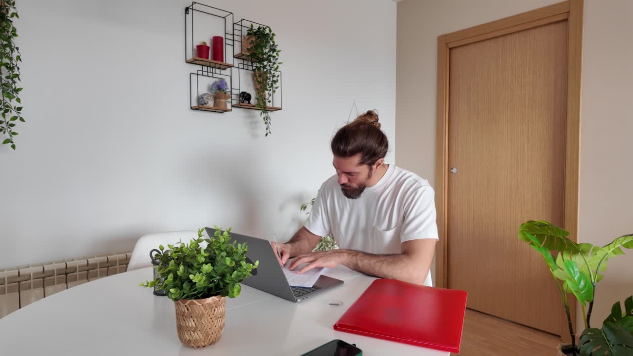 Man working on a laptop at a table