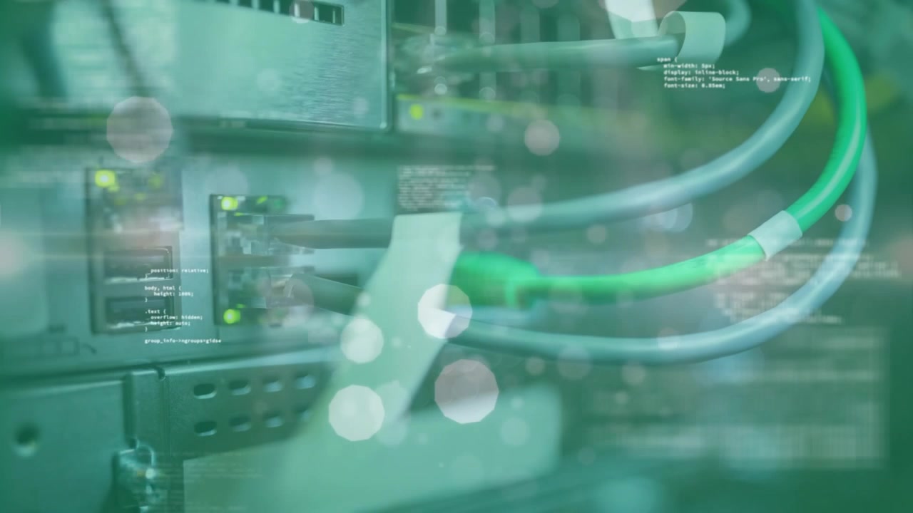Animation of lens flares, circles, computer language against back panel of machinery and with wires