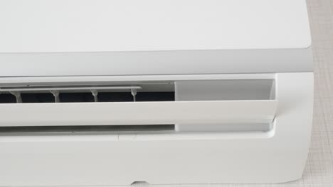 close-up of a wall-mounted air conditioner unit.