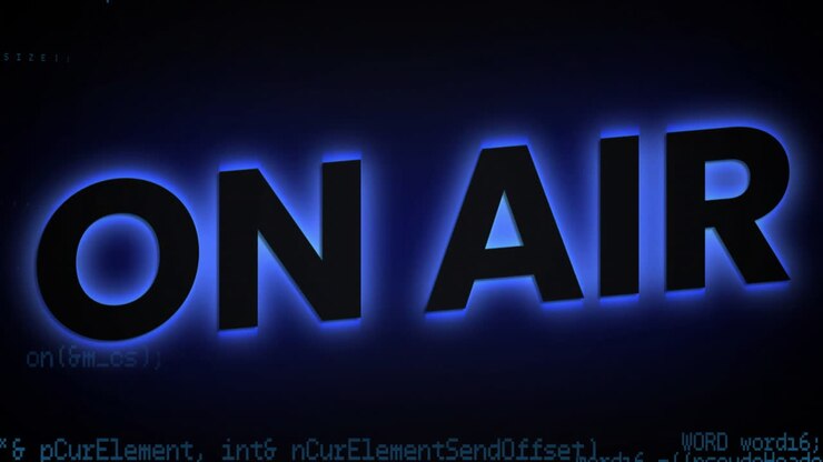 Glowing On Air text over animation of programming code snippets in background