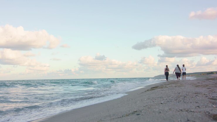 Women walking on the beach.