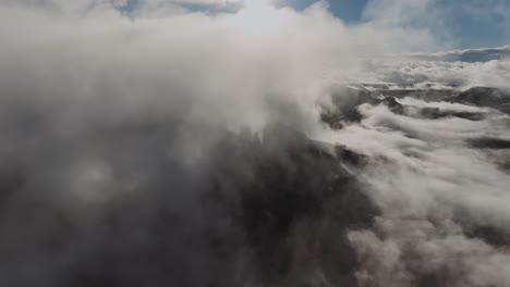 Cloudscape-Canopied-Dark-Sky-Over-Mountain-Peaks-At-Dawn