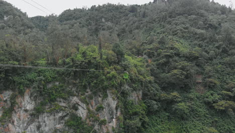 aerial view of green cable car in tolima - colombia