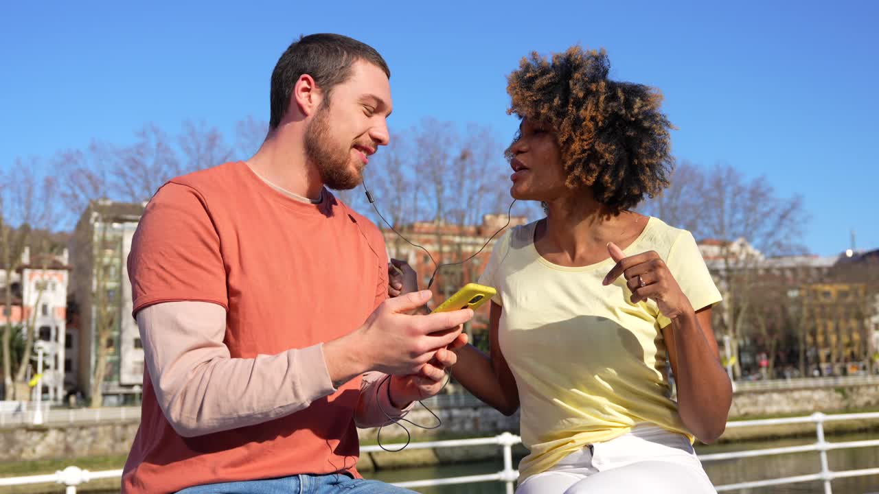Couple Enjoying Music Together Outdoors