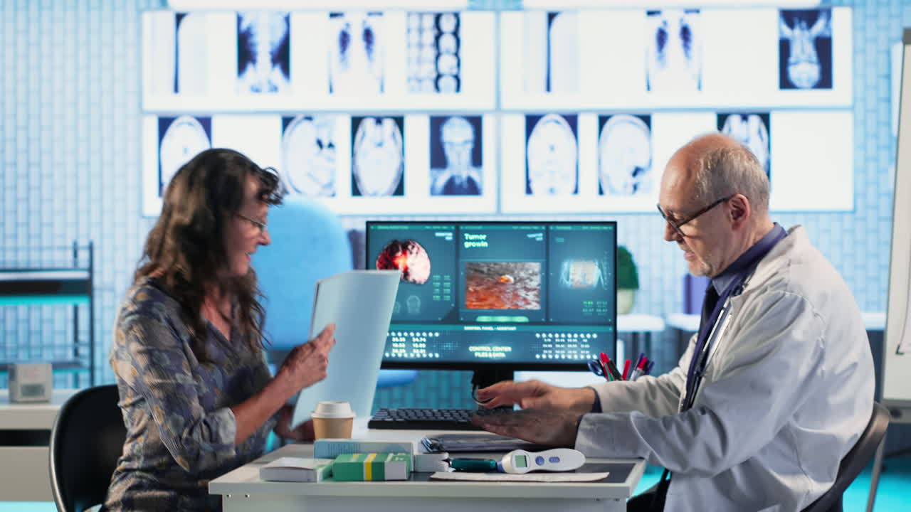 Vertical Video Old specialist meeting with a woman patient to discuss results in a cabinet